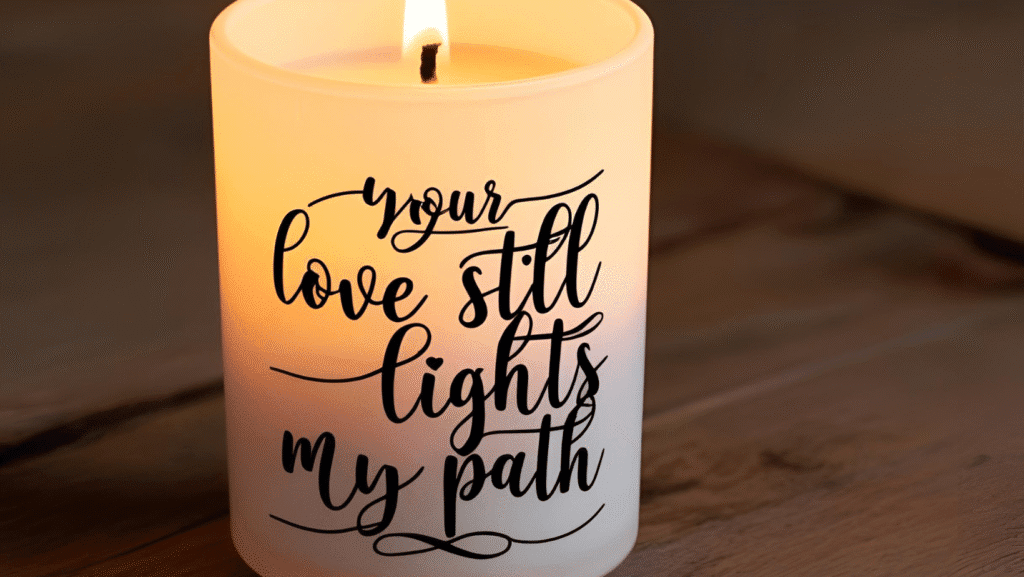 A glowing candle with the quote, “Your love still lights my path,” overlaid in elegant script.