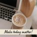 A bright workspace with a laptop, coffee, and a note reading, “Make today matter!”