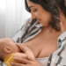 New mother having difficulty with breastfeeding latch, showing realistic nursing struggles